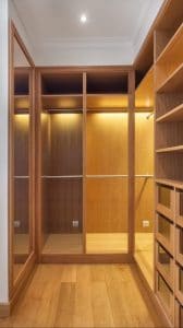 Cabinets and an empty dressing room made of wood, for the family.